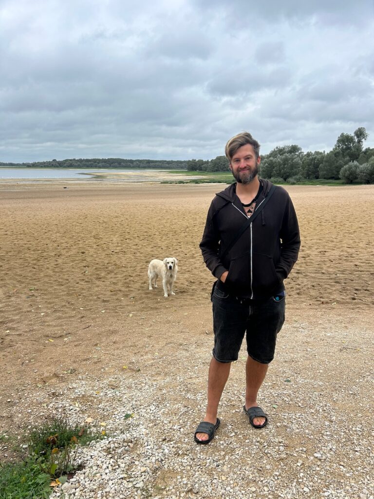 Micha and dog Finn on a beach